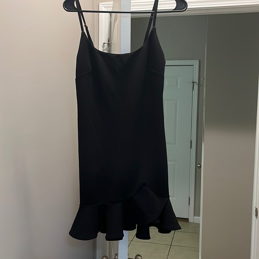 Black Tight skinny dress with little flare at the bottom. From a small boutique